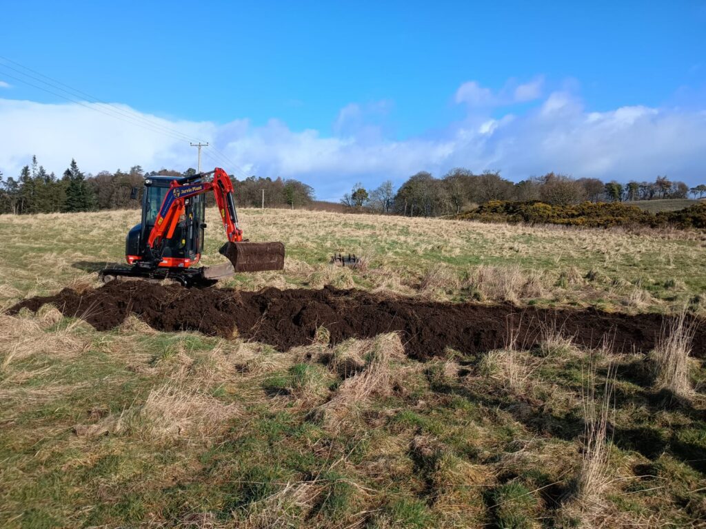 Digger creating a wader scrape